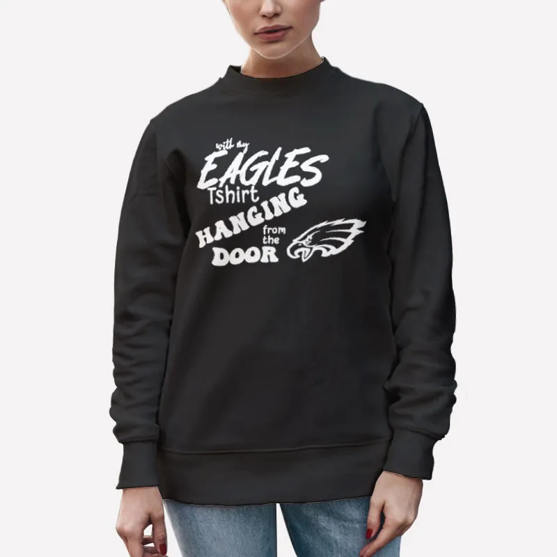 Unisex Sweatshirt Black With My Eagles T Shirt Hanging From The Door