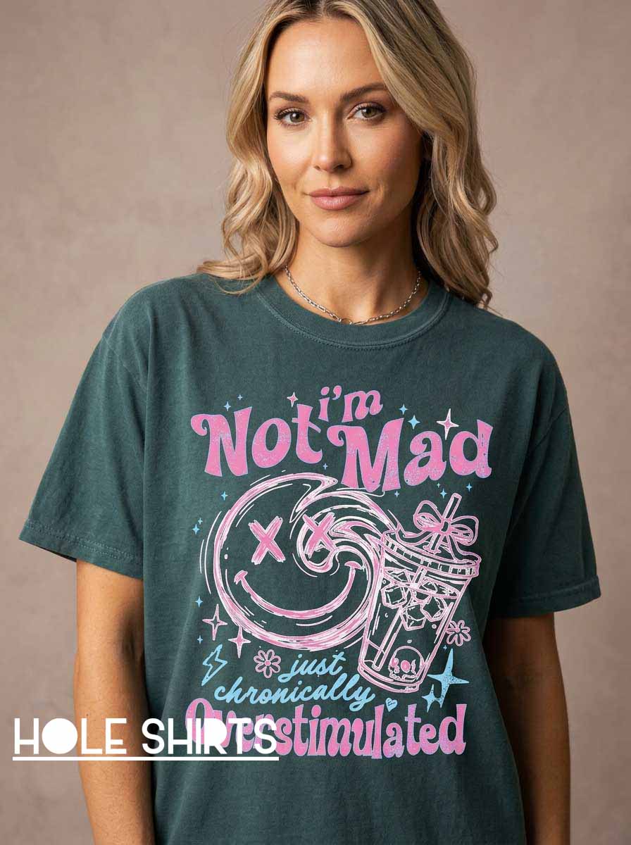 Chronically Overstimulated Smiley Face Sassy T Shirt featuring a playful smiley face graphic and sarcastic slogan for humor lovers, introverts, overwhelmed adults, and fans of relatable novelty apparel.